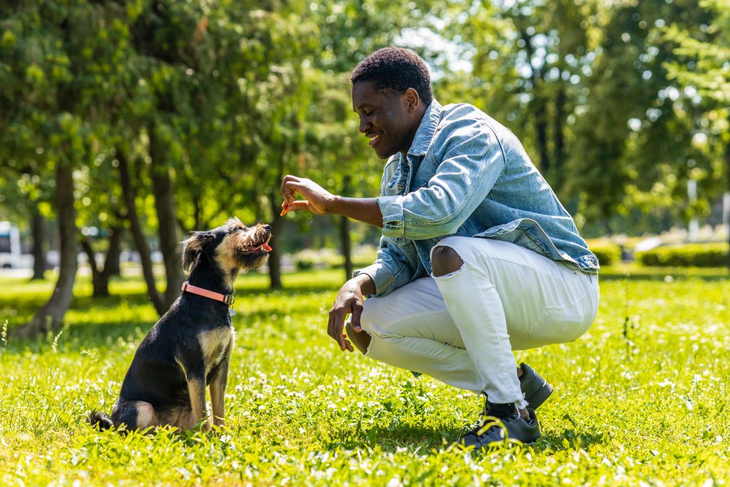 man with a dog outside